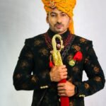 Portrait of a Rajput Groom Holding a Wedding Sword